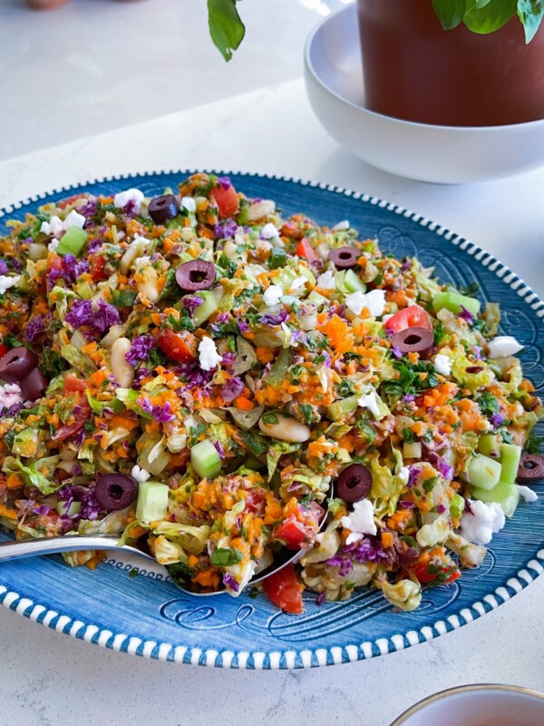 lettuce, tomatoes, cucumbers, olives and vegan feta cheese with white bean dressing