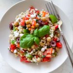 pearl couscous, bell peppers, onions, tomatoes, olives and lemon dressing