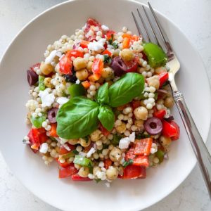 pearl couscous, bell peppers, onions, tomatoes, olives and lemon dressing