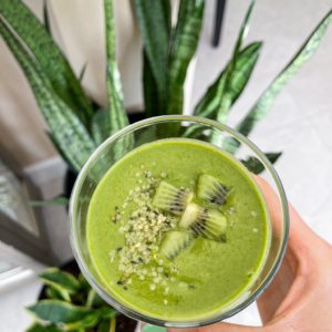 green smoothie made with bananas, zucchini, spinach and all vegan peanut butter