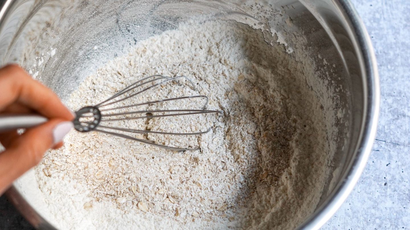 whisking the dry ingredients in a mixing bowl