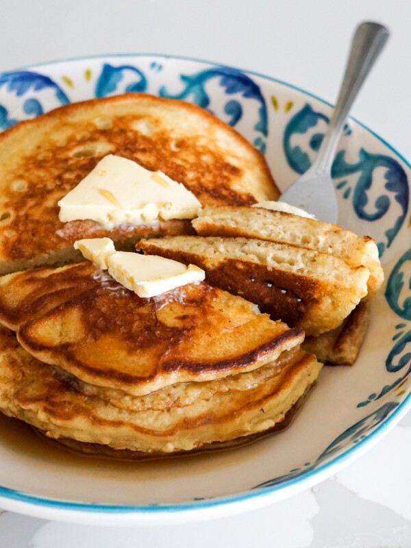 pancakes with dairy free butter on a blue and white plate