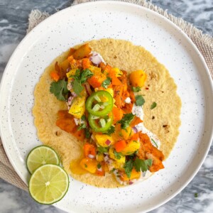 Weeknight Chicken Tacos with Mango Salsa on a white plate