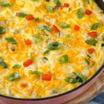 hahsbrowns, vegan eggs and cheese in a skillet