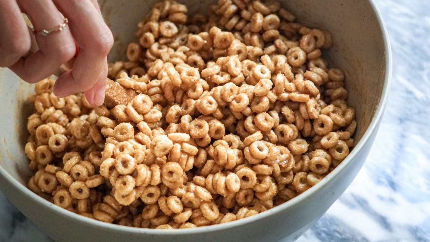 mixing cereal bars in a large bowl