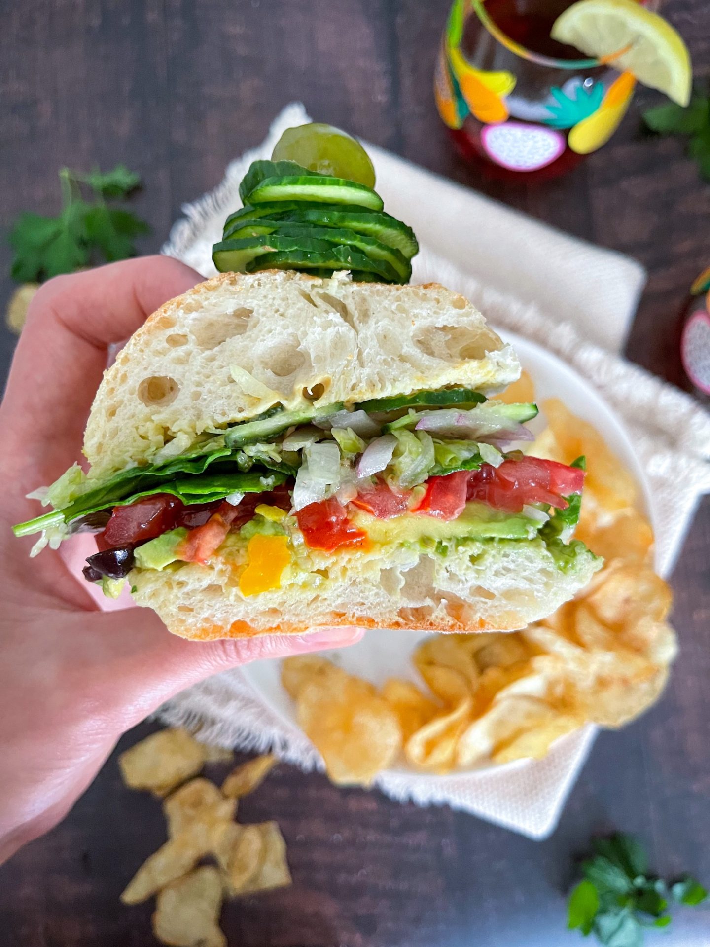 veggie sub sandwich on a wooden board