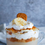 vanilla pudding in a glass jar with whipped cream