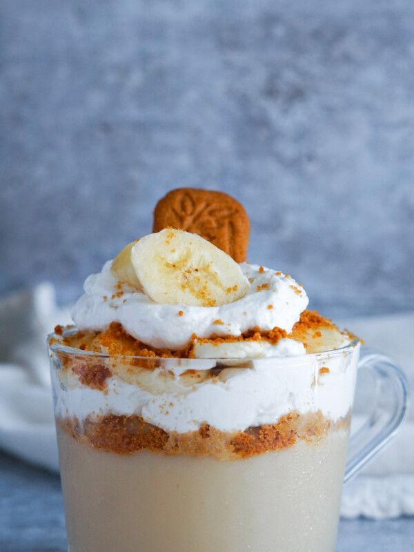 vanilla pudding in a glass jar with whipped cream