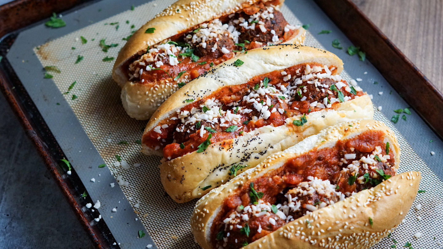 lentil meatball subs on a baking tray