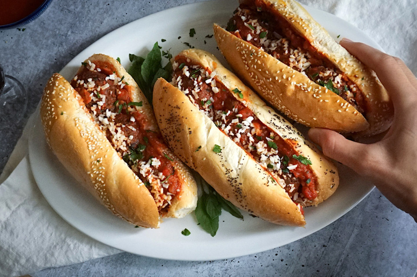meatball subs on a white plate