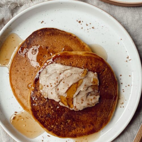 pumpkin pancakes with cinnamon butter on a plate