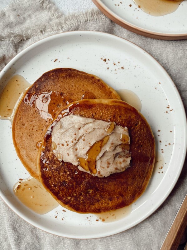 pumpkin pancakes with cinnamon butter on a plate