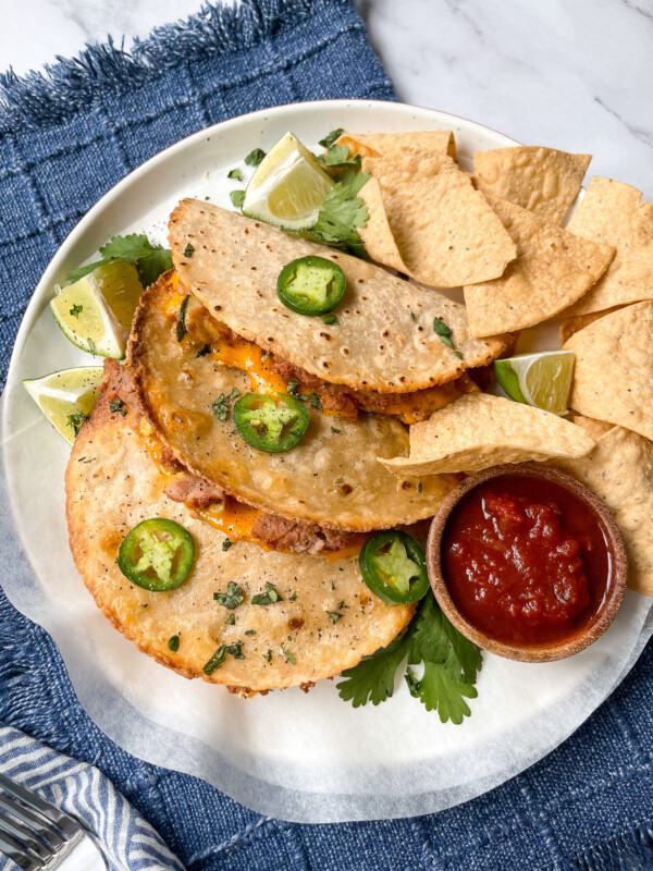 vegetable tacos and salsa on a white plate