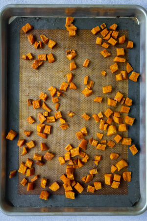 roasted sweet potatoes on a cookie sheet