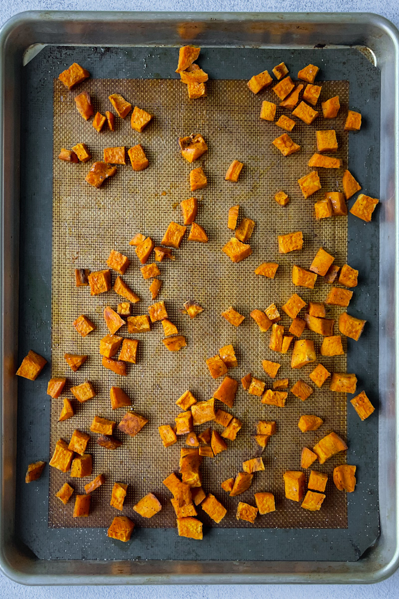 roasted sweet potatoes on a cookie sheet