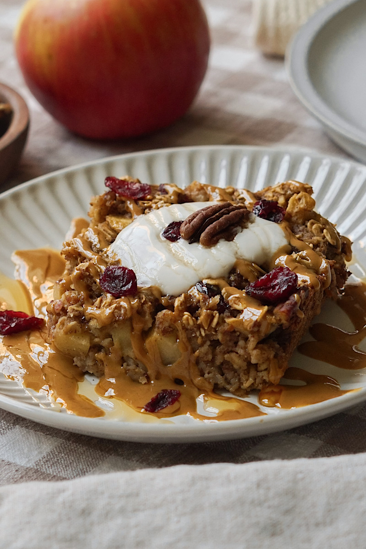 baked oatmeal topped with dried cranberries and pecans