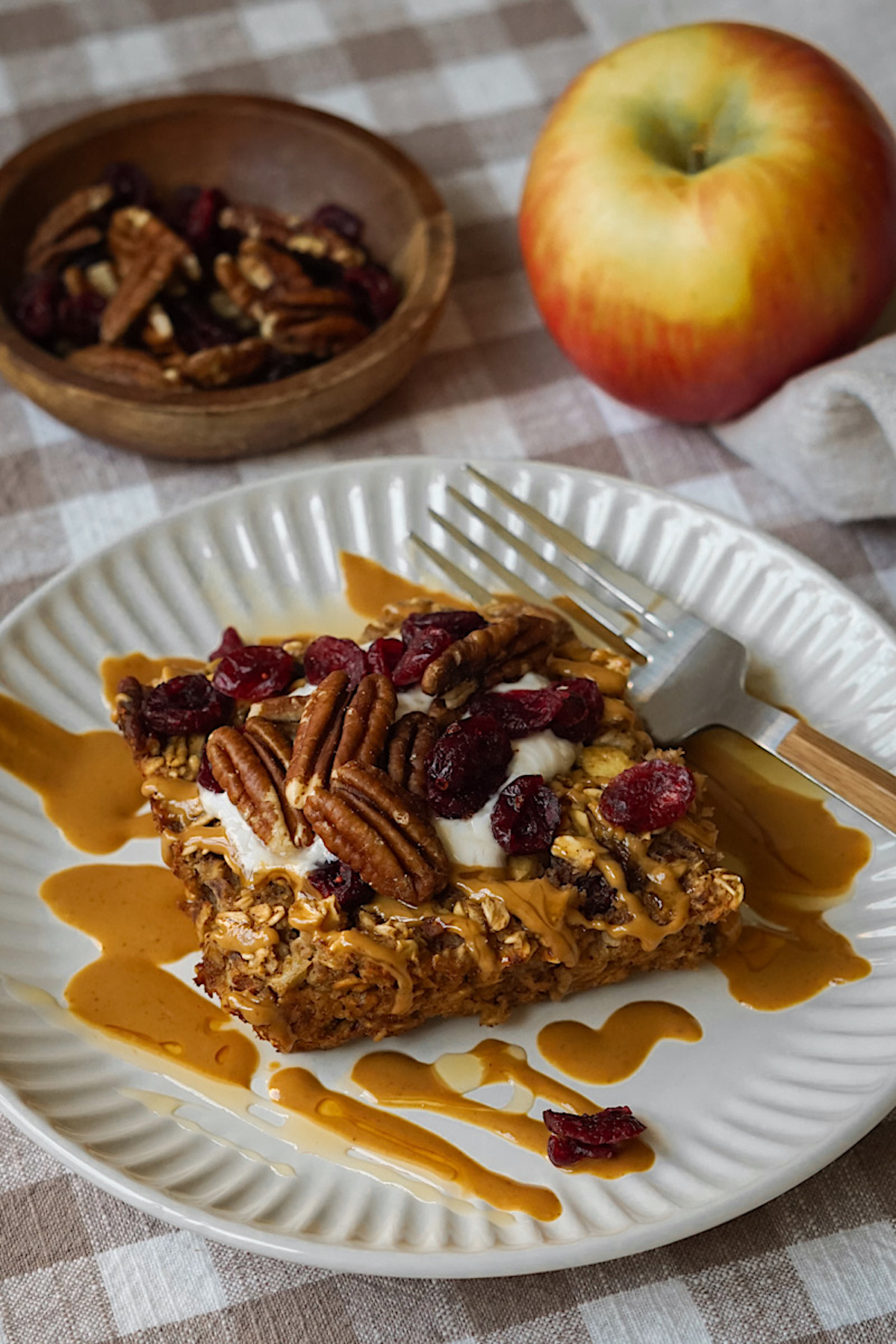 baked oatmeal sliced and served on a white plate