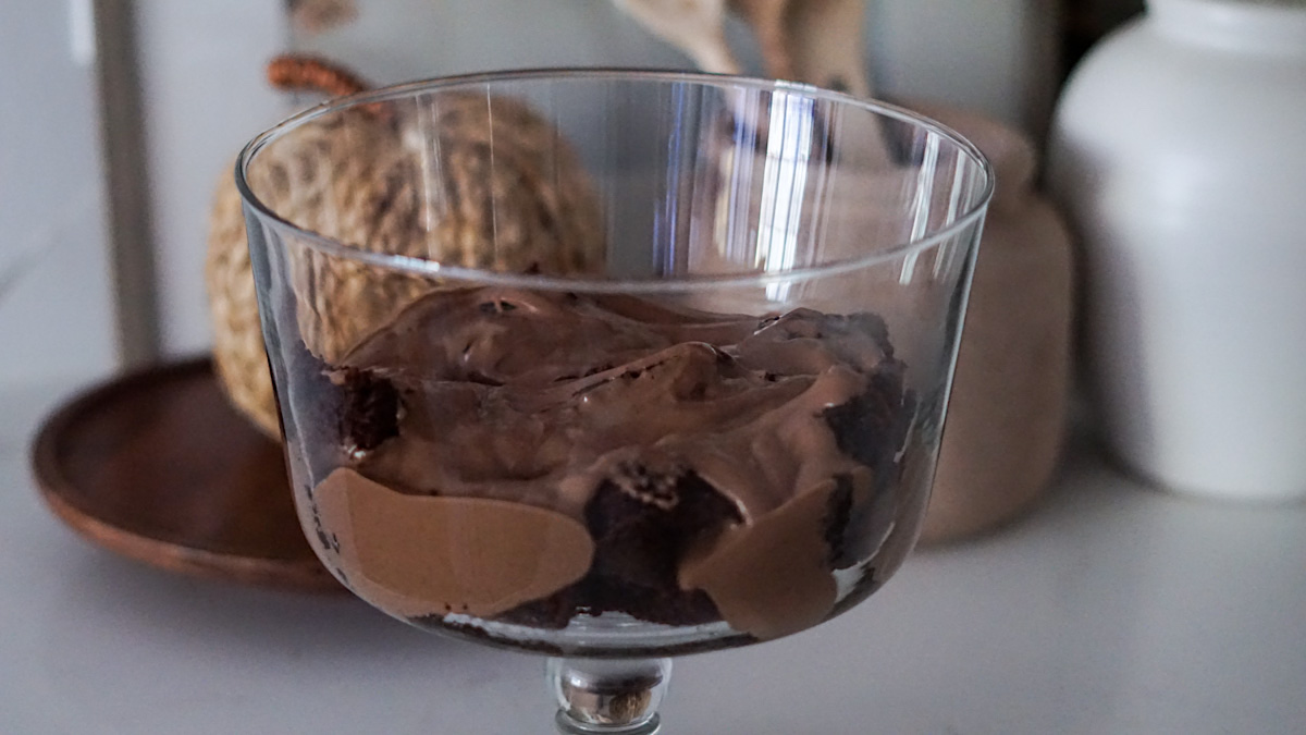 making a chocolate trifle dessert recipe with chocolate cake and chocolate pudding 