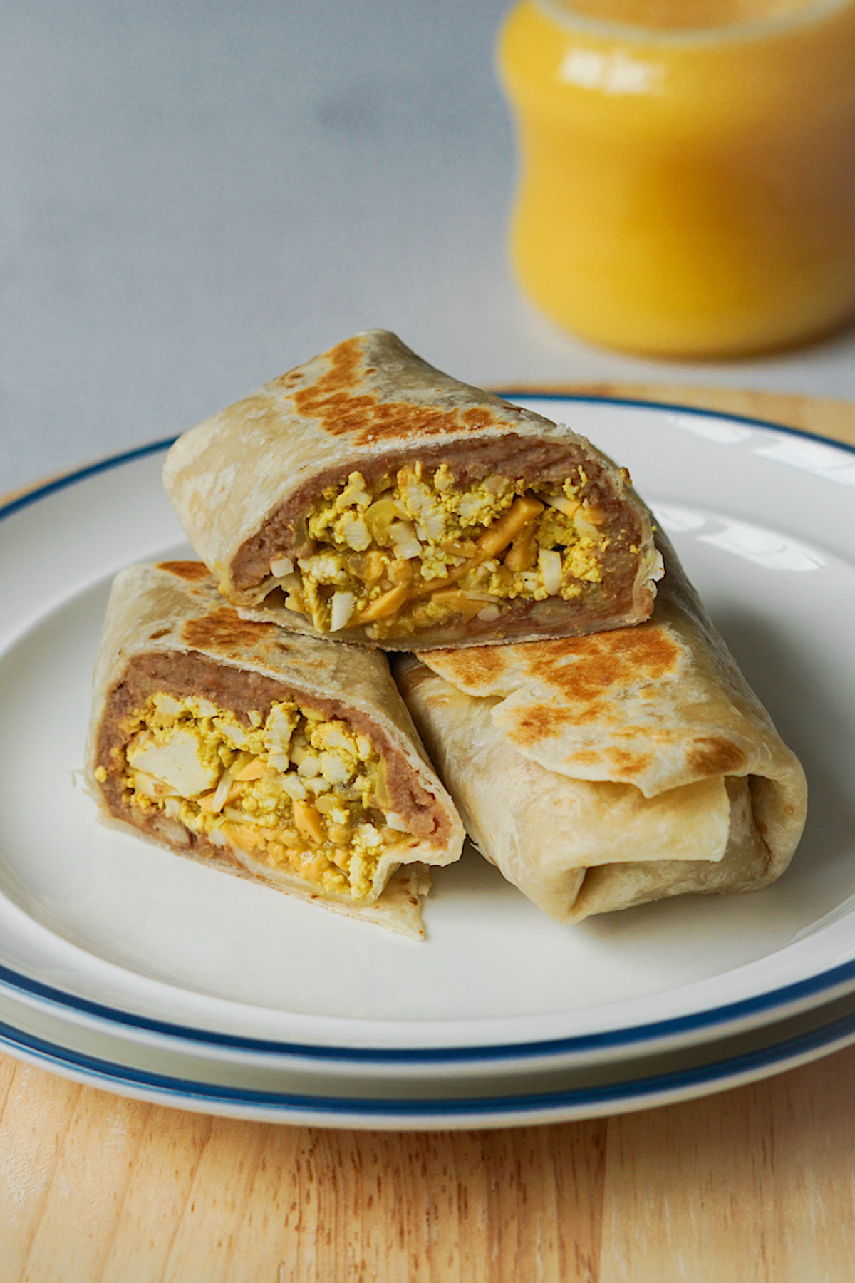 healthy breakfast burritos on a white plate 