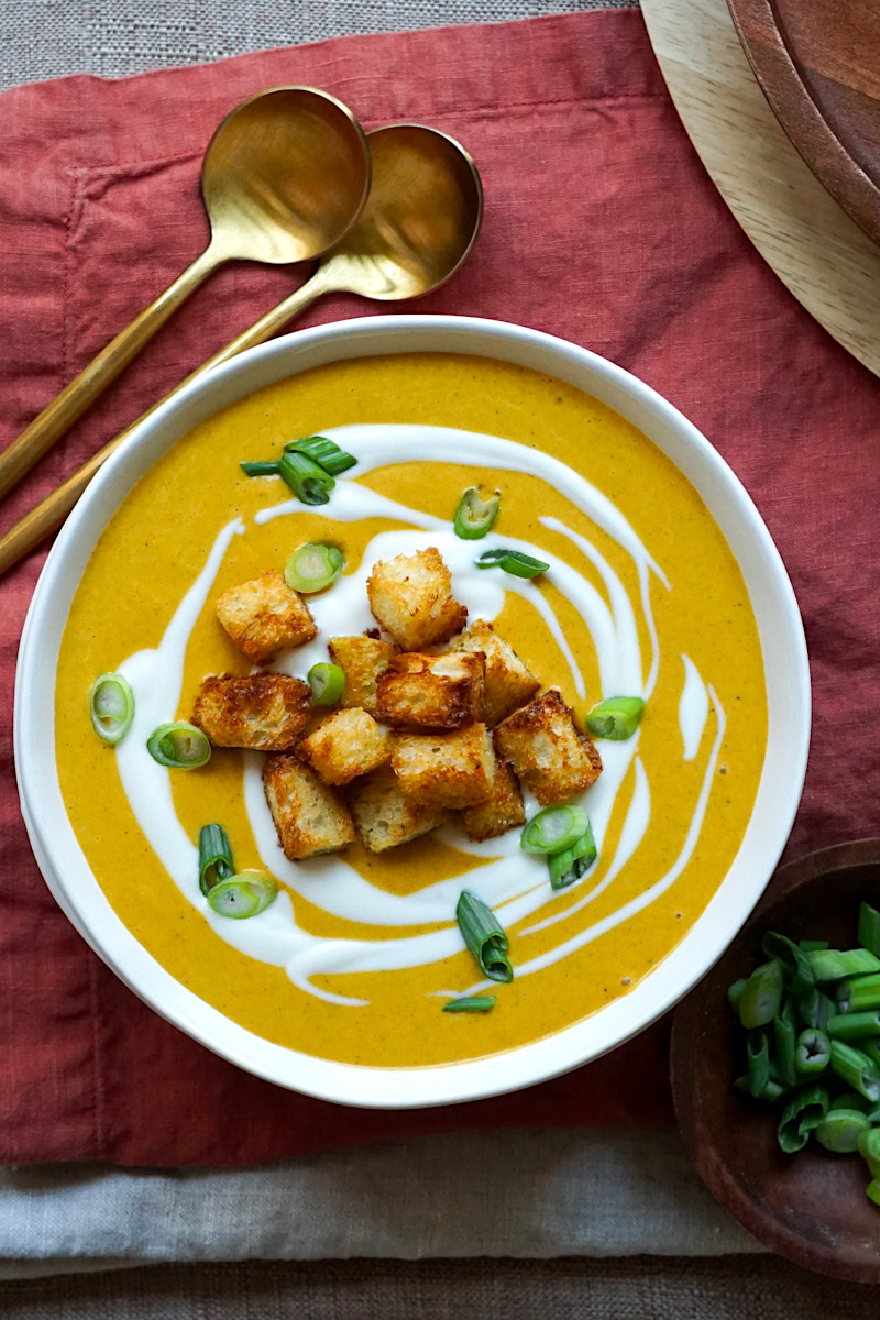 carrot ginger soup in a white bowl